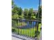 Peaceful balcony view overlooking a pond and lush landscaping at 277 Valencia Cir, St Petersburg, FL 33716