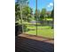 Relaxing screened patio with wooden deck overlooking a pond at 277 Valencia Cir, St Petersburg, FL 33716