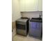 Well-lit laundry room, complete with washer and dryer at 277 Valencia Cir, St Petersburg, FL 33716