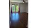 Bright bedroom featuring hardwood floors and access to a balcony at 277 Valencia Cir, St Petersburg, FL 33716