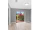 Light and airy bedroom with sliding glass doors leading to the backyard at 1826 Wolf Laurel Dr, Sun City Center, FL 33573