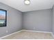 Simple bedroom with grey walls and wood-look floors at 1826 Wolf Laurel Dr, Sun City Center, FL 33573