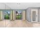 Light and bright entryway with wood floors and large mirror at 1826 Wolf Laurel Dr, Sun City Center, FL 33573