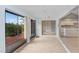 Sunroom with wood-look flooring and access to the backyard at 1826 Wolf Laurel Dr, Sun City Center, FL 33573
