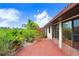 Spacious backyard with lush landscaping and a relaxing patio area at 1826 Wolf Laurel Dr, Sun City Center, FL 33573