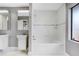 Updated bathroom with double vanity, tile flooring and a bathtub at 1826 Wolf Laurel Dr, Sun City Center, FL 33573