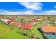 Aerial view of community with various houses and lush green spaces at 1826 Wolf Laurel Dr, Sun City Center, FL 33573