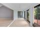 Bright sunroom with multiple windows and access to the outdoors at 1826 Wolf Laurel Dr, Sun City Center, FL 33573