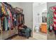 Large walk-in closet with ample shelving and hanging space at 7443 Surrey Wood Ln, Apollo Beach, FL 33572
