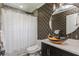 Bathroom with decorative wallpaper, a vessel sink and walk-in shower with curtain at 120 Chesapeake Ave, Tampa, FL 33606