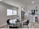 Open-concept kitchen and dining area features modern gray cabinets and stainless steel appliances at 120 Chesapeake Ave, Tampa, FL 33606