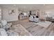 Open-concept living room with gray wood floors and a seamless flow into the modern kitchen at 120 Chesapeake Ave, Tampa, FL 33606