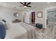 Bright main bedroom featuring recessed lights, a ceiling fan and an ensuite bath with modern fixtures at 120 Chesapeake Ave, Tampa, FL 33606