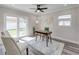 Office with a ceiling fan, a desk, and glass sliding door leading to a patio at 120 Chesapeake Ave, Tampa, FL 33606