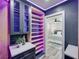 Walk-in closet with accent lighting, custom cabinets and open doorway to main bedroom at 120 Chesapeake Ave, Tampa, FL 33606