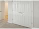 Double-door closet with neutral walls and carpeting at 12398 Oak Hill Way, Parrish, FL 34219