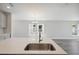 Modern kitchen island with quartz countertop and sink at 12386 Oak Hill Way, Parrish, FL 34219