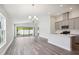 Open living room and kitchen with wood-look floors at 12378 Oak Hill Way, Parrish, FL 34219