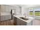 Modern kitchen with gray cabinets and quartz countertops at 12378 Oak Hill Way, Parrish, FL 34219