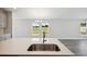 Kitchen island with sink and stainless steel faucet at 12378 Oak Hill Way, Parrish, FL 34219