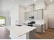 Kitchen with gray cabinets, stainless steel appliances and an island at 12378 Oak Hill Way, Parrish, FL 34219