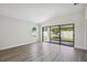 Bright living room featuring sliding glass doors and backyard access at 12378 Oak Hill Way, Parrish, FL 34219