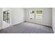 Bedroom with sliding glass doors to patio and gray carpet at 12378 Oak Hill Way, Parrish, FL 34219