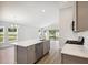 Kitchen with island, stainless steel appliances, and white cabinets at 12378 Oak Hill Way, Parrish, FL 34219