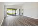 Spacious living room with sliding glass doors leading to backyard at 12378 Oak Hill Way, Parrish, FL 34219