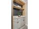 Laundry room with custom cabinetry, open shelving, and a spacious countertop at 120 Chesapeake Ave, Tampa, FL 33606