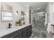 Elegant bathroom with dual vanity and a patterned shower at 120 Chesapeake Ave, Tampa, FL 33606