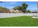 Large backyard with lush green grass and a white fence at 120 Chesapeake Ave, Tampa, FL 33606