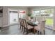 Bright dining area with glass table and modern chairs, near sliding glass doors at 120 Chesapeake Ave, Tampa, FL 33606