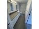 Bathroom with tiled floors, dual mirrors, and ample counter space at 849 Laurelridge Ct, Brooksville, FL 34601