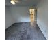 Bright bedroom with gray carpet and access to bathroom at 849 Laurelridge Ct, Brooksville, FL 34601