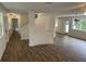 Bright living area featuring luxury vinyl flooring and freshly painted walls at 849 Laurelridge Ct, Brooksville, FL 34601