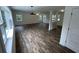Spacious living room with luxury vinyl flooring and abundant natural light from large windows at 849 Laurelridge Ct, Brooksville, FL 34601