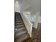 Clean staircase with newly carpeted steps and a freshly painted white railing at 849 Laurelridge Ct, Brooksville, FL 34601