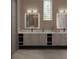 Double vanity bathroom with marble countertops and modern lighting at 5223 29Th S Ave, St Petersburg, FL 33707