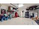 Organized garage with plenty of storage solutions at 11411 Drifting Leaf Dr, Riverview, FL 33579