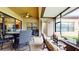 Covered patio with comfortable seating and views of the backyard at 11411 Drifting Leaf Dr, Riverview, FL 33579