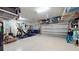 Spacious garage with overhead storage and work area at 11411 Drifting Leaf Dr, Riverview, FL 33579