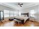 Bright main bedroom with king-size bed and plenty of natural light at 11411 Drifting Leaf Dr, Riverview, FL 33579