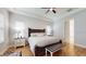 Spacious bedroom with wood flooring and large windows at 11411 Drifting Leaf Dr, Riverview, FL 33579