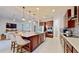 Open kitchen boasting a large island, stainless steel appliances and breakfast bar at 11411 Drifting Leaf Dr, Riverview, FL 33579