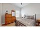 Bedroom with wood floors and a dresser at 11411 Drifting Leaf Dr, Riverview, FL 33579