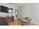 Bright bonus room with large TV and built-in shelving at 11411 Drifting Leaf Dr, Riverview, FL 33579
