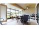 Spacious screened patio with seating area and outdoor kitchen at 11411 Drifting Leaf Dr, Riverview, FL 33579