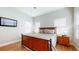 Bright bedroom with wood floors and a ceiling fan at 11411 Drifting Leaf Dr, Riverview, FL 33579