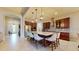 Modern kitchen with large island and breakfast bar, open to living areas at 11411 Drifting Leaf Dr, Riverview, FL 33579